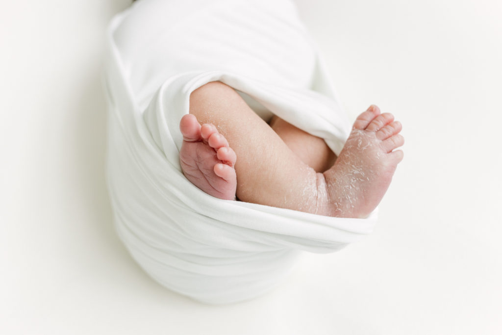 Close up of newborn baby's feet.